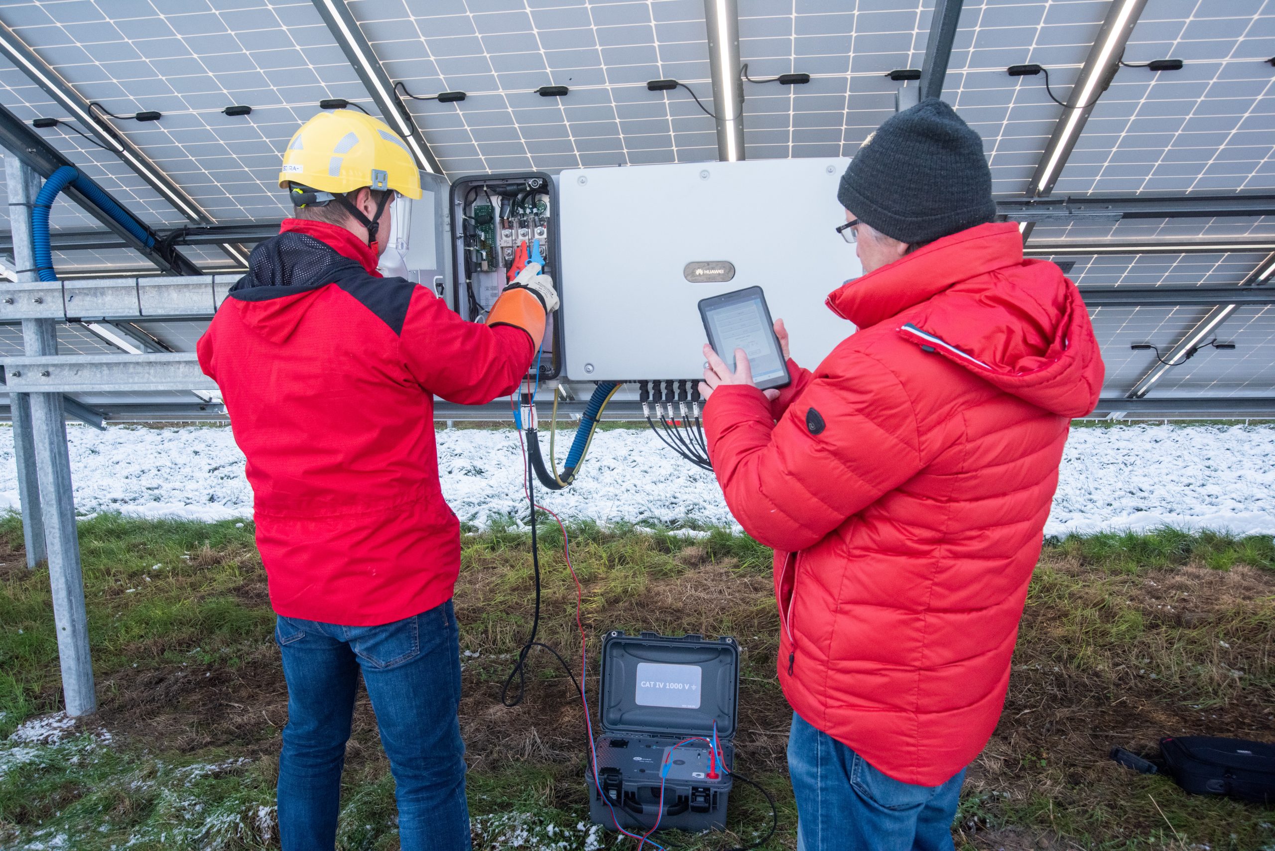 Taking measurements using the Sonel MZC-340-PV meter on a solar power farm inverter